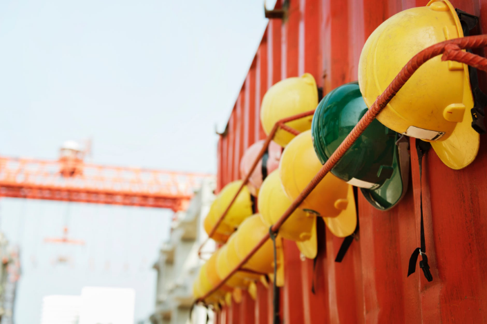 yellow helmets on a construction site
