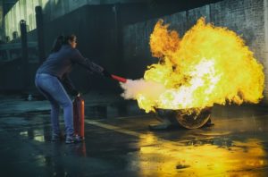 using a fire extinguisher